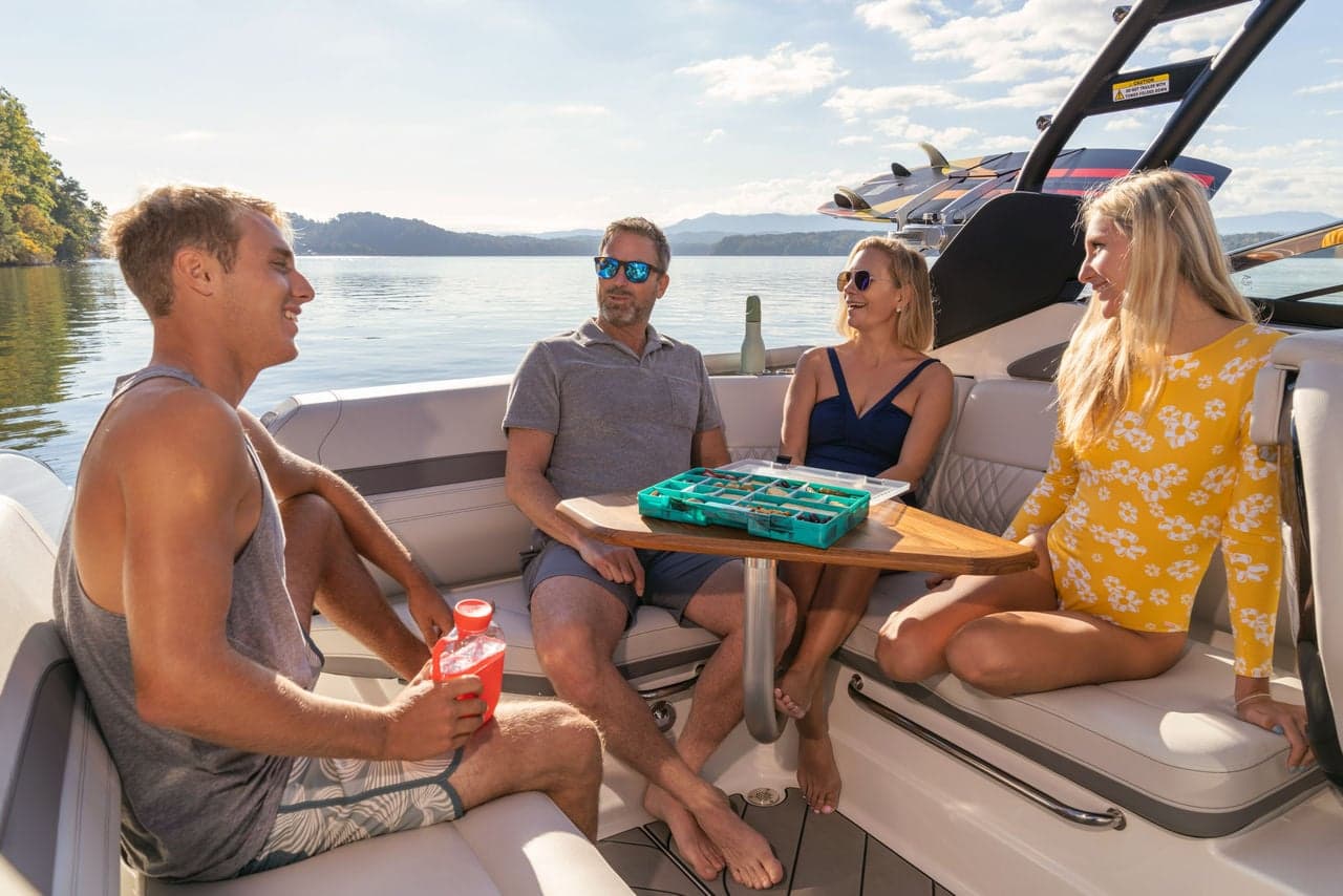 Family eating around the SLX 260 Surf cockpit table