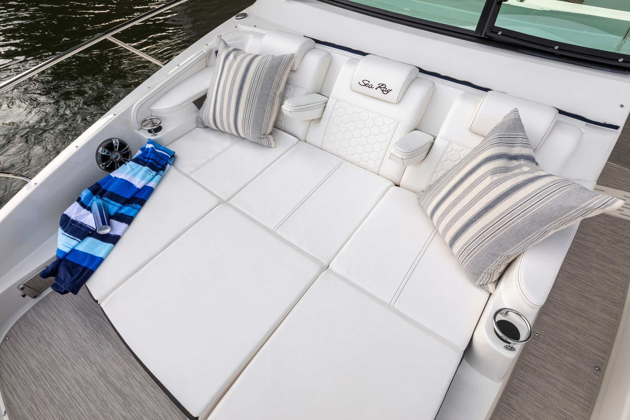 Sundancer 320 bow sunpad on calm water