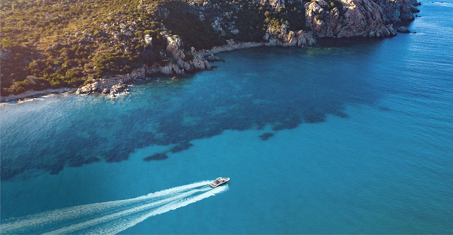 Aerial view of an SLX 400 underway in deep blue water